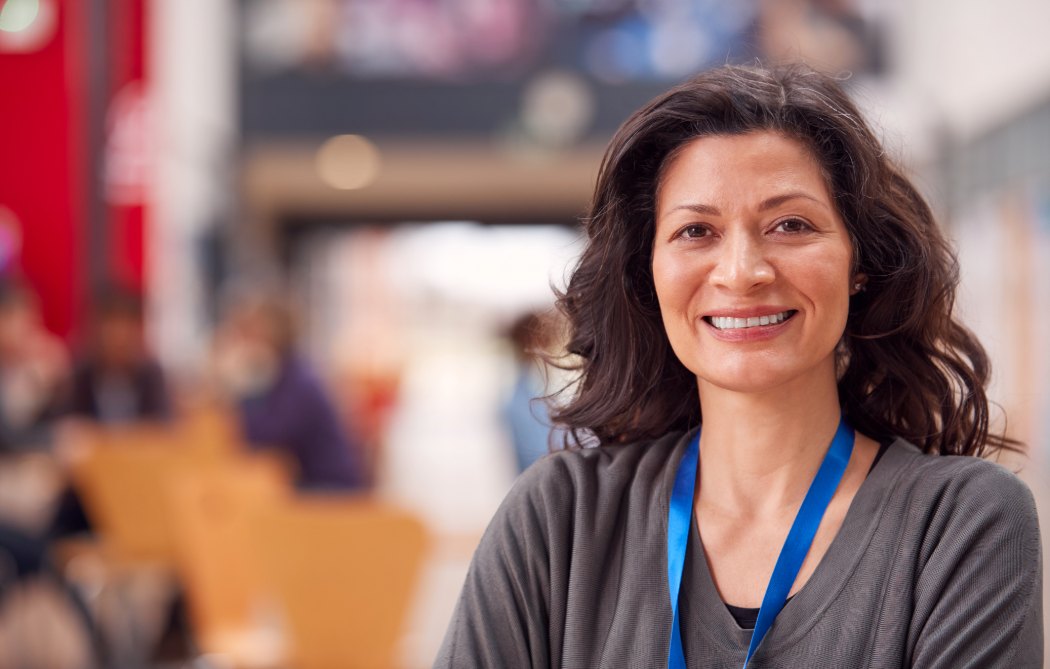 Portrait Of Mature Assist Support Services Or Student In College Hall - Support Coordinators | Disability Support Services Melbourne
